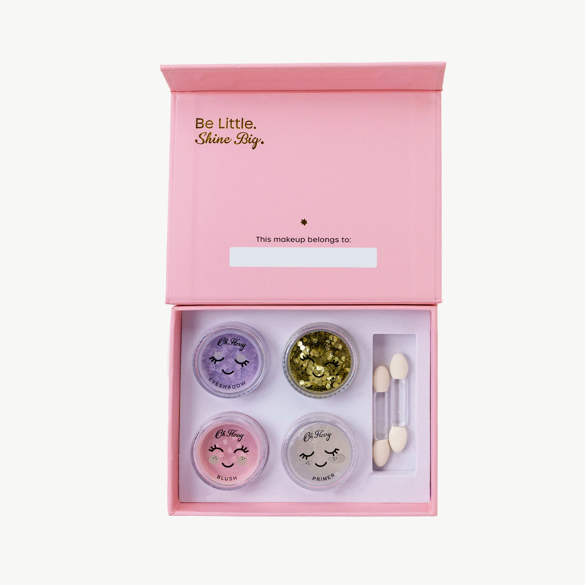 Makeup set with four containers and applicators in a pink box with 'Be Little, Shine Big' text.