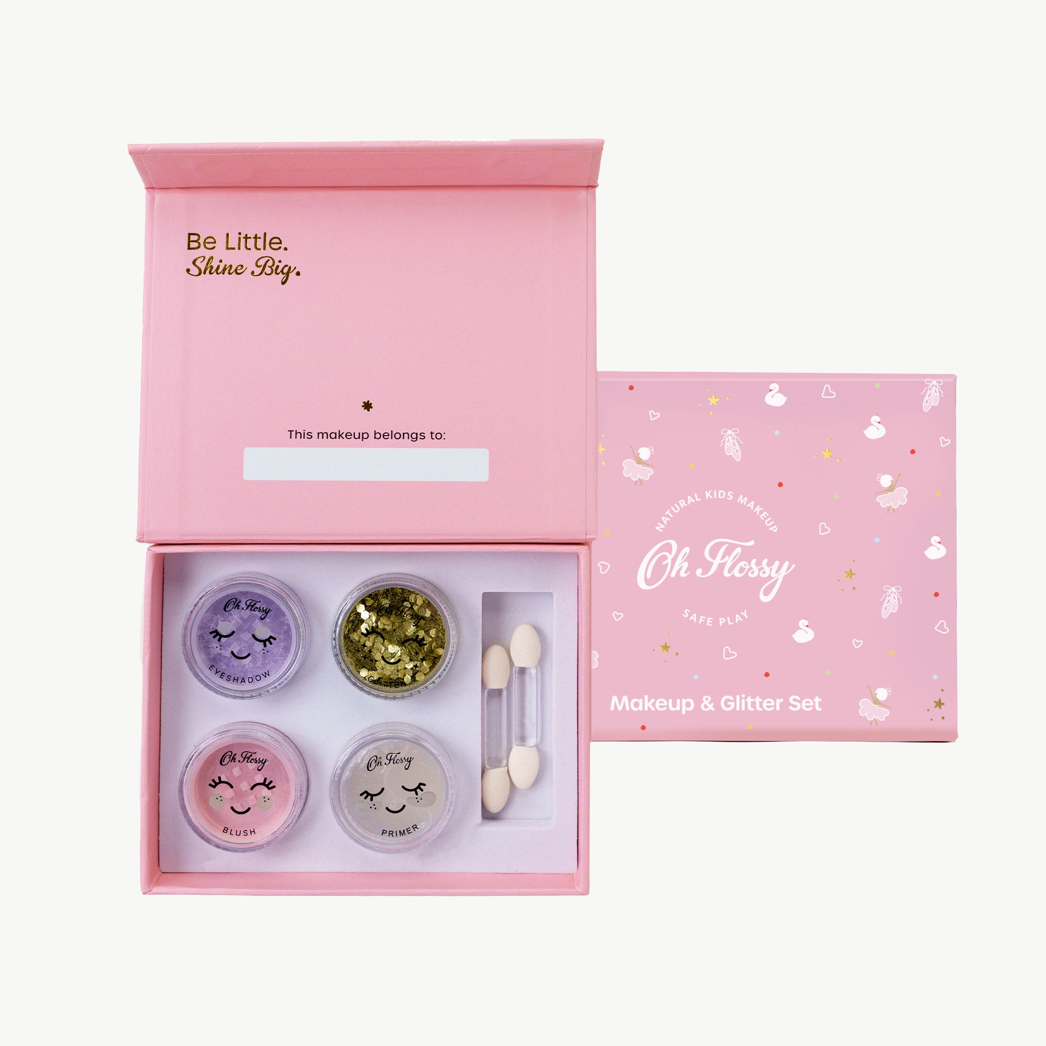 Makeup and glitter set with 'Oh Flossy' branding in a pink box.