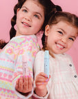 Oh-Flossy-Kids-Natural-Makeup-Lip-gloss-duo-on-hands