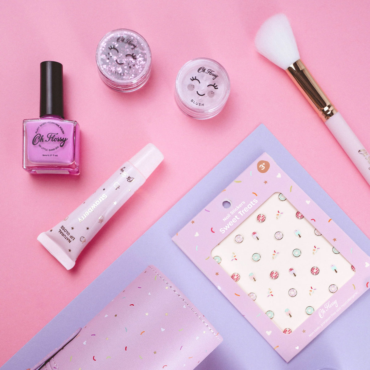 Oh Flossy makeup and beauty products for kids, including nail polish, lipgloss, glitter and blush pots, nail stickers and brushes